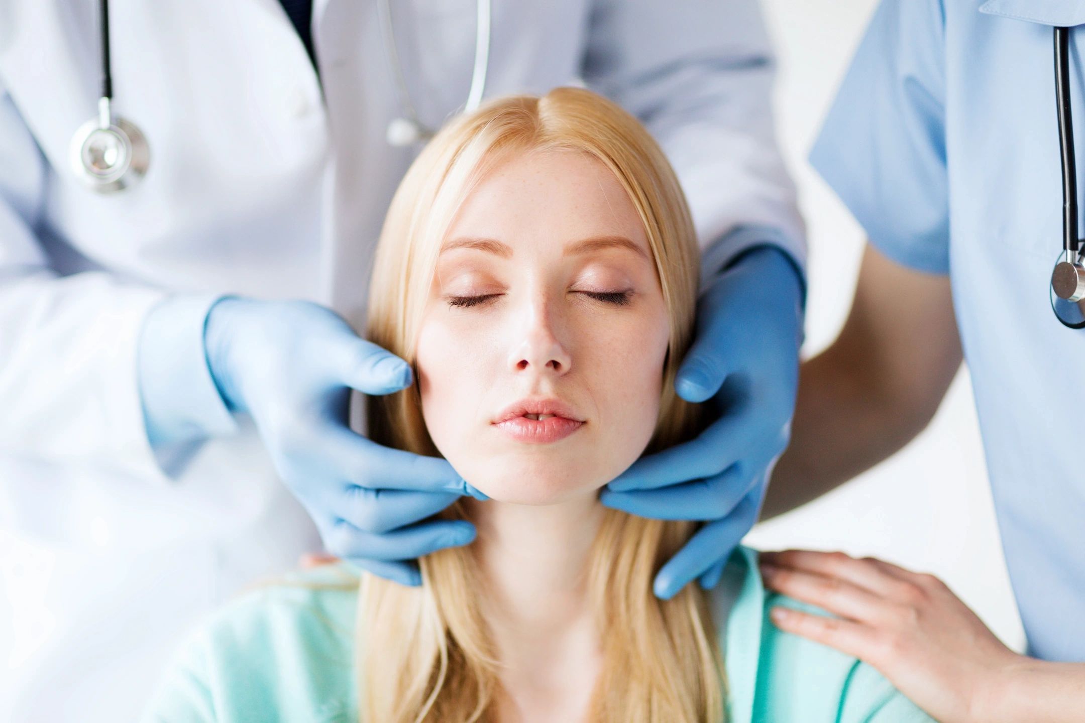 Woman at doctor's office without fine lines and wrinkles getting botulinum toxin ("botox") injections